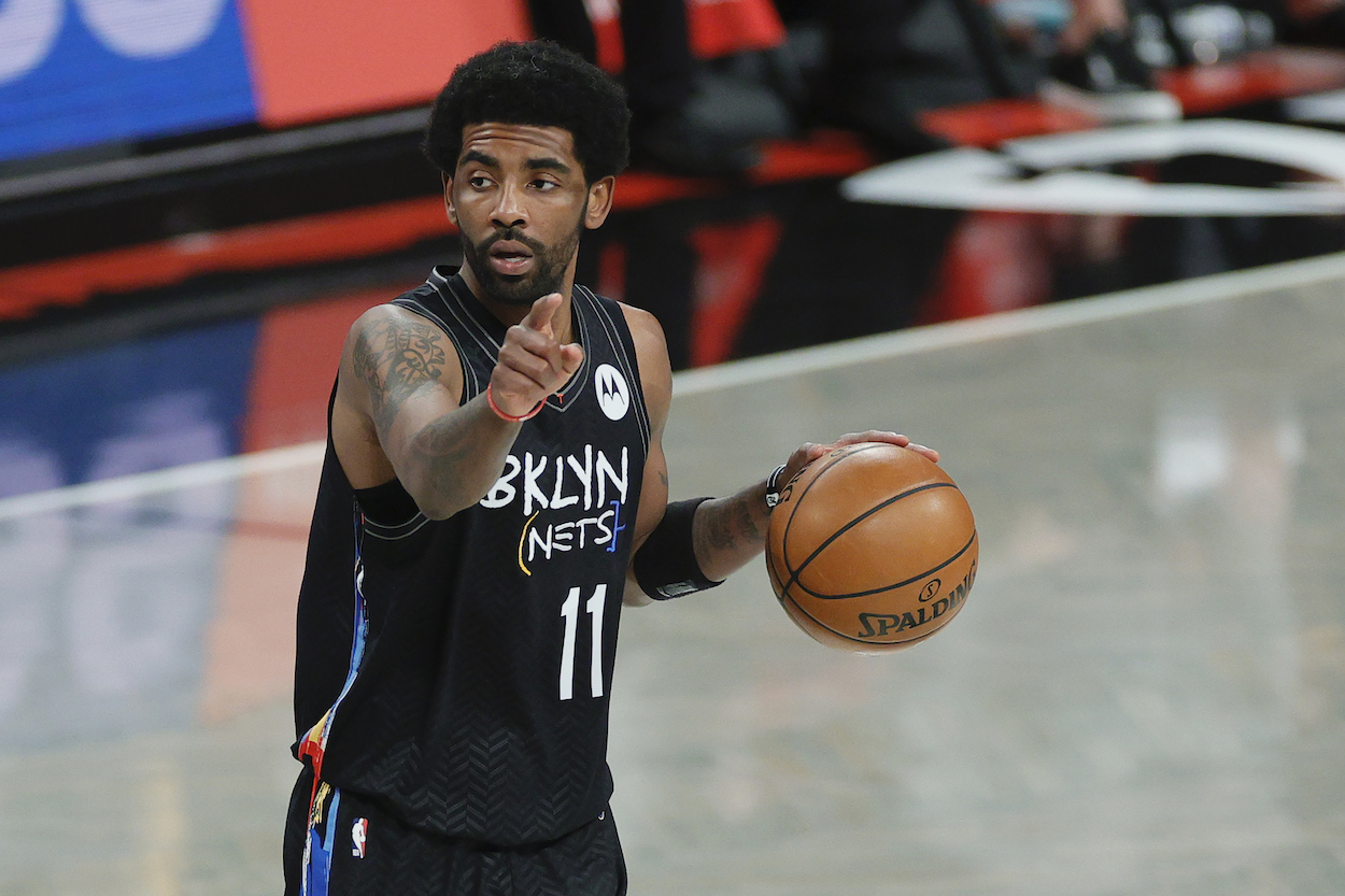 Kyrie Irving of the Brooklyn Nets dribbles ball up court