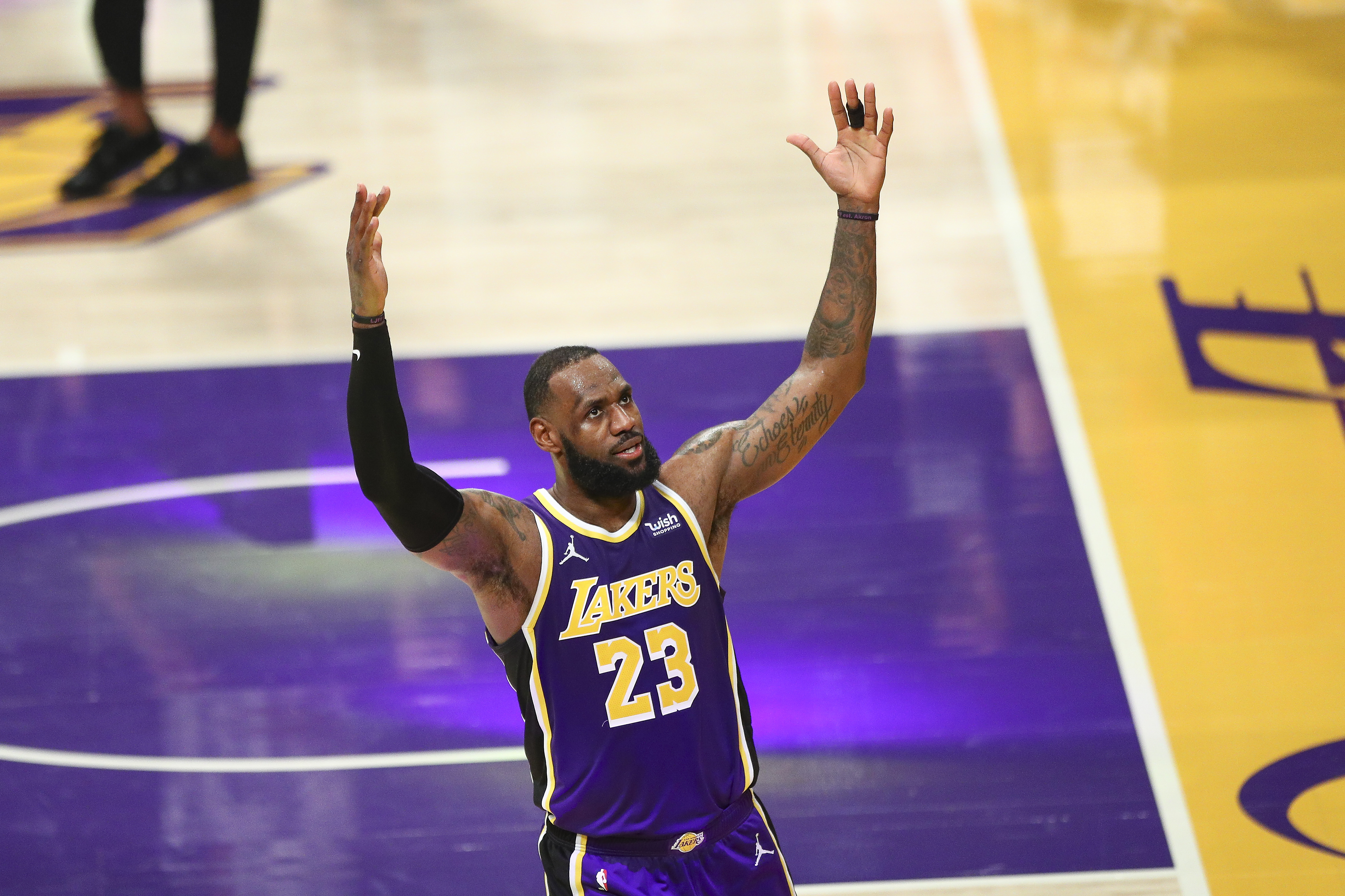 LeBron James celebrates after hitting a shot for the Lakers against the Grizzlies in February 2021