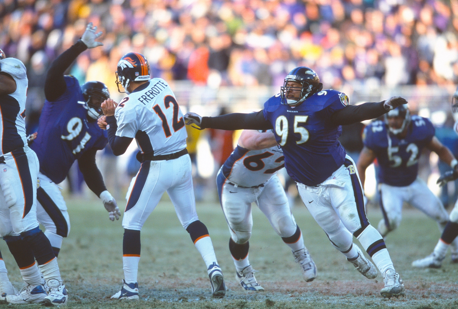 Baltimore Ravens defensive tackle Lional Dalton attempts to tackle Denver Broncos quarterback Gus Frerotte.