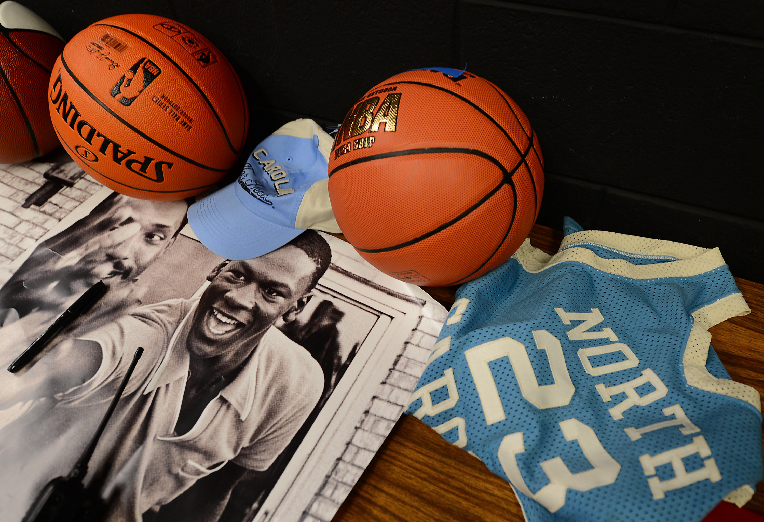 Michael Jordan items sit on a table backstage at Vance High School on Thursday, March 21, 2013. Bobcats Sports and Entertainment, along with FOX Sports Carolinas/Sports South announced a $200,000 donation to Y Achievers, a YMCA of Greater Charlotte program that operates in partnership with Charlotte-Mecklenburg Schools.