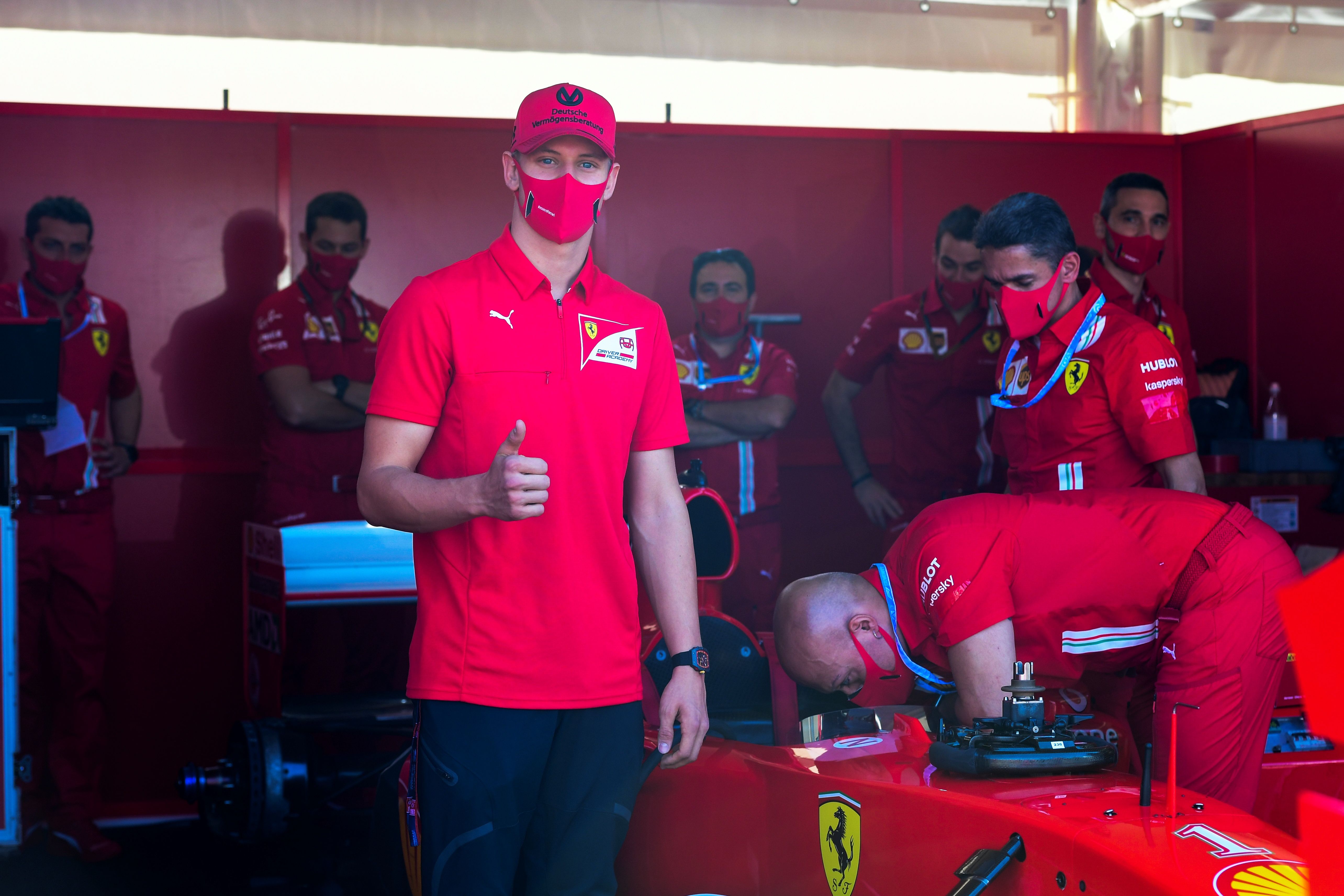 Mick Schumacher, son of former F1 champion Michael Schumacher, visits the Ferrari pit in 2020
