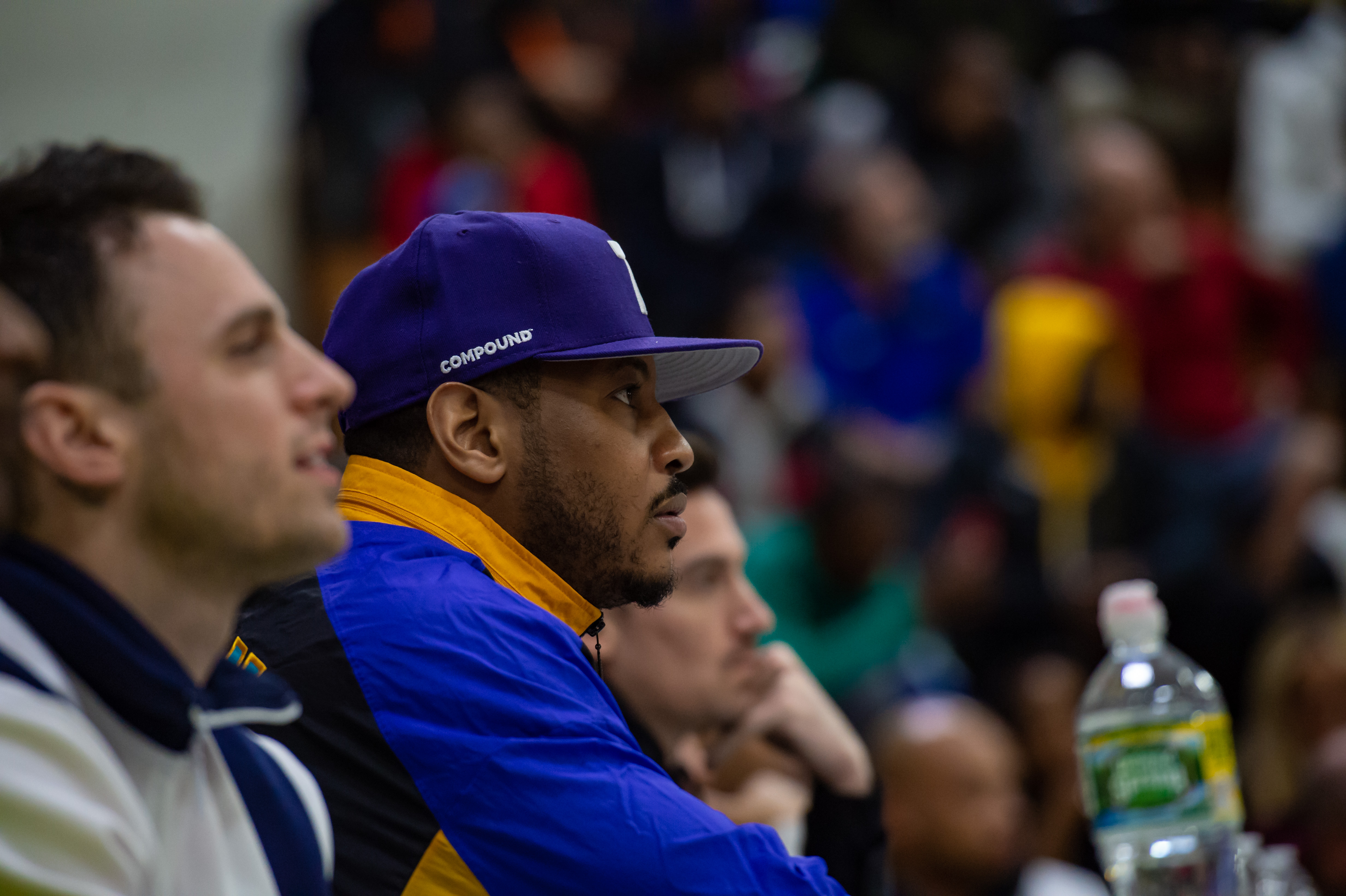 Oak Hill Academy alum Carmelo Anthony takes in the action during an Oak Hill basketball game in 2019