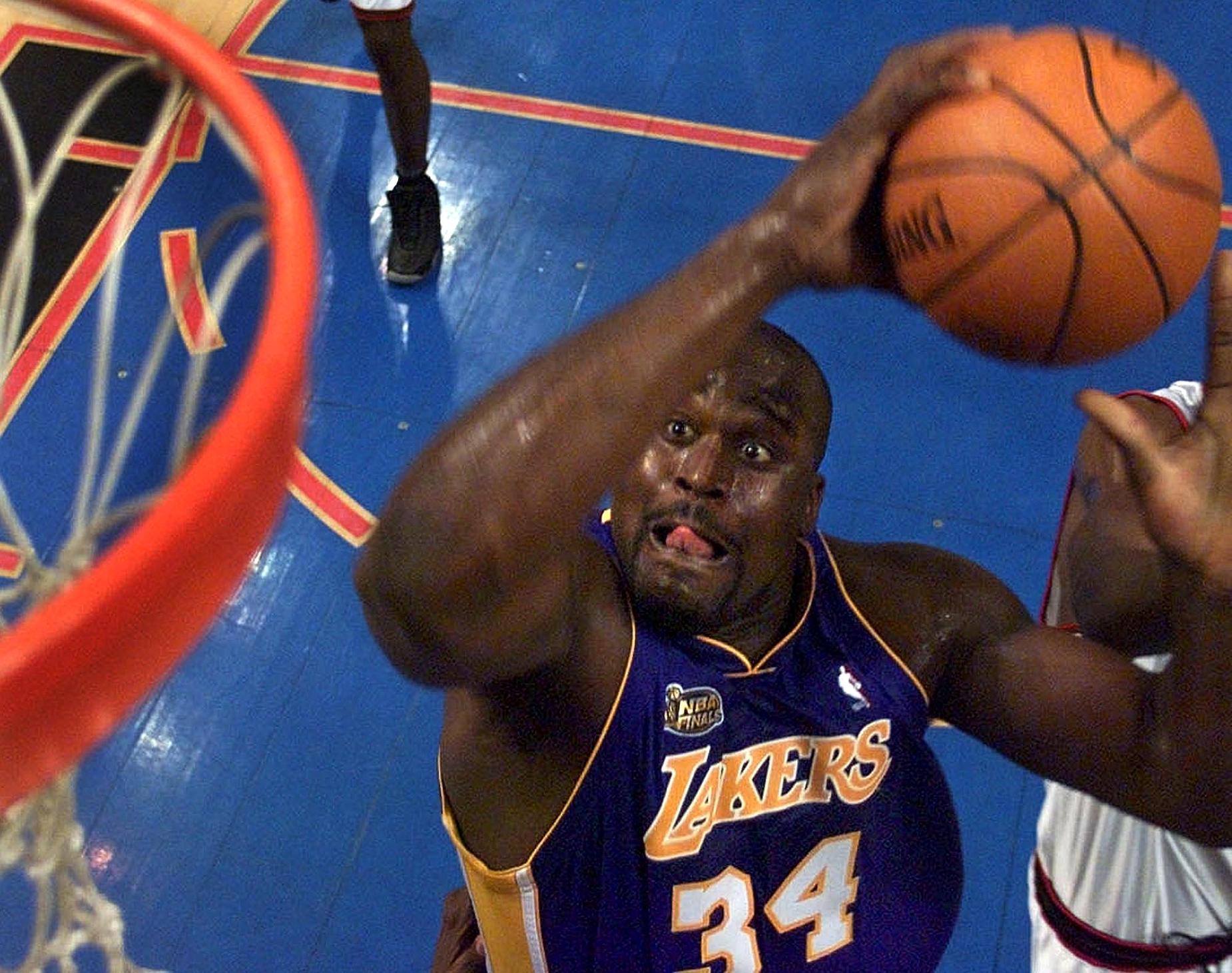 Shaquille O'Neal throws down a dunk during his time with the LA Lakers.
