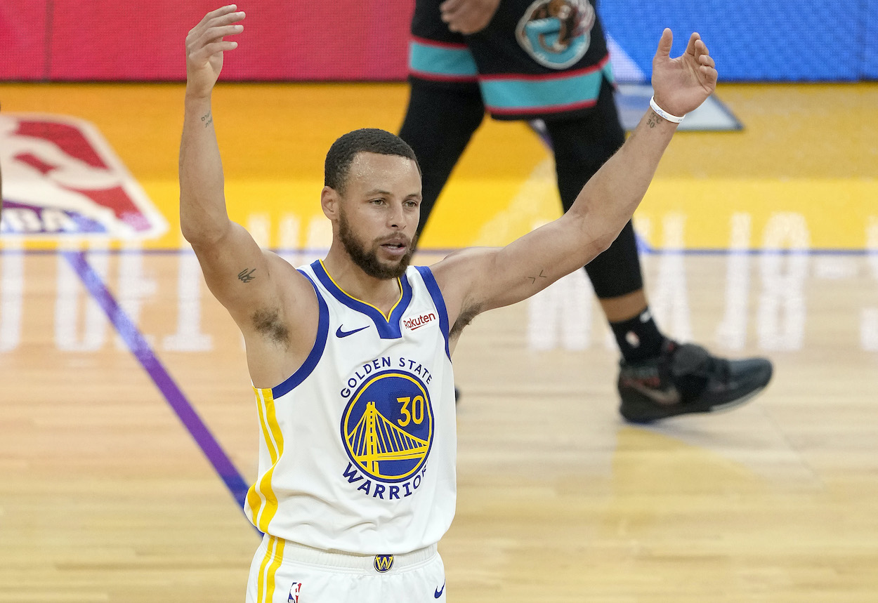 Stephen Curry of the Golden State Warriors celebrates after shooting and making a three-point shot against the Memphis Grizzlies during the second half of an NBA basketball game at Chase Center on May 16, 2021 in San Francisco, California.