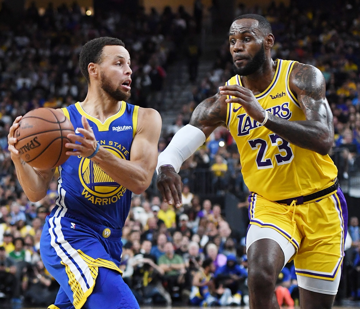 Stephen Curry and LeBron James battle during a Warriors-Lakers matchup in 2018