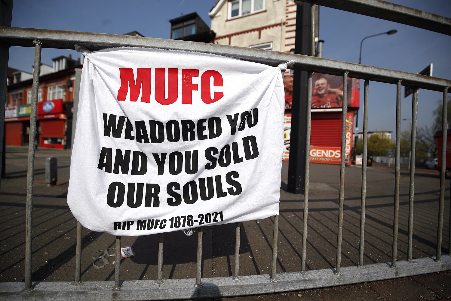 A banner left by Manchester United fans objecting to the decision by the owners of the Tampa Bay Buccaneers to join the European Super League.