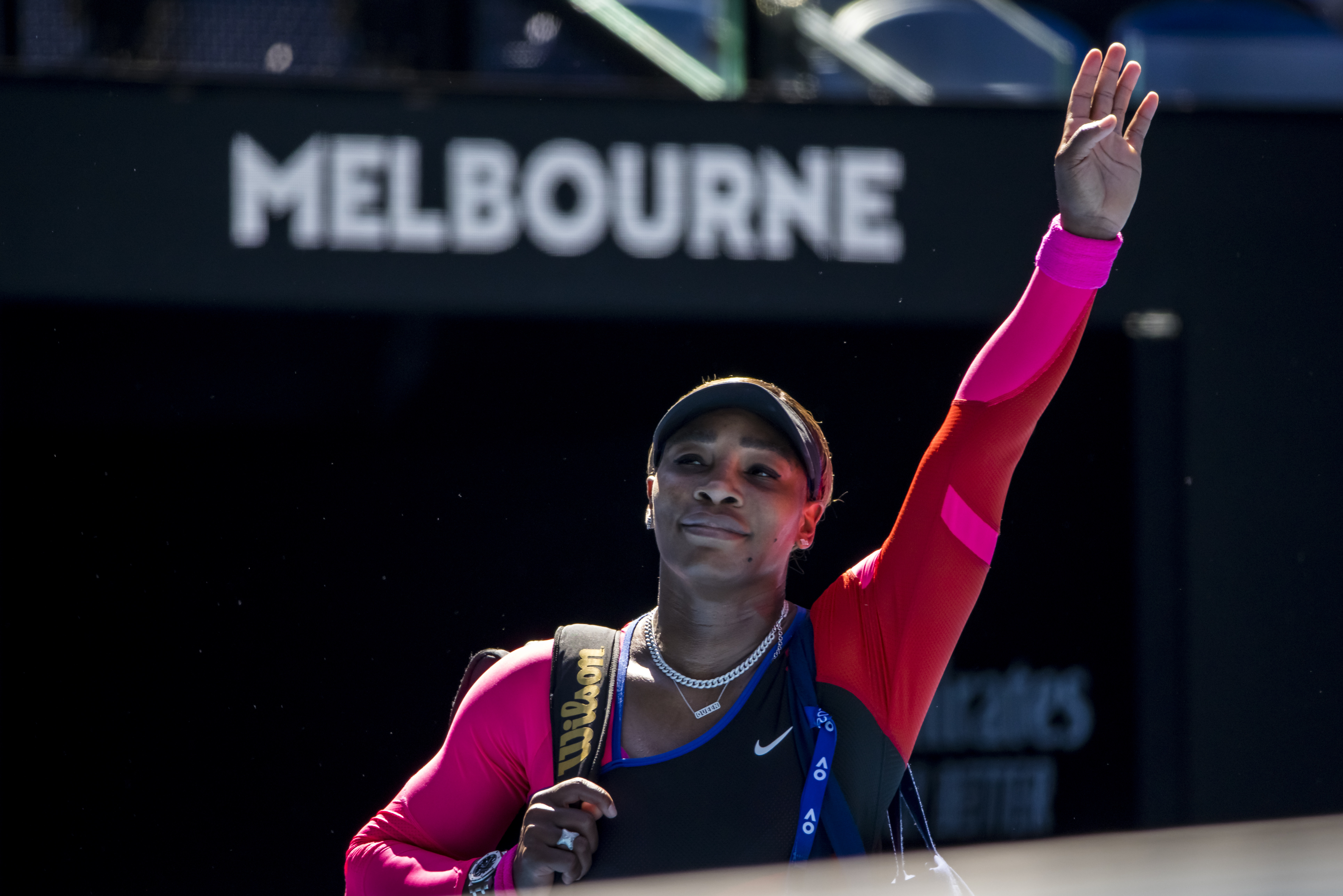 Serena Williams waves farewell after losing against Naomi Osaka at the 2021 Australian Open