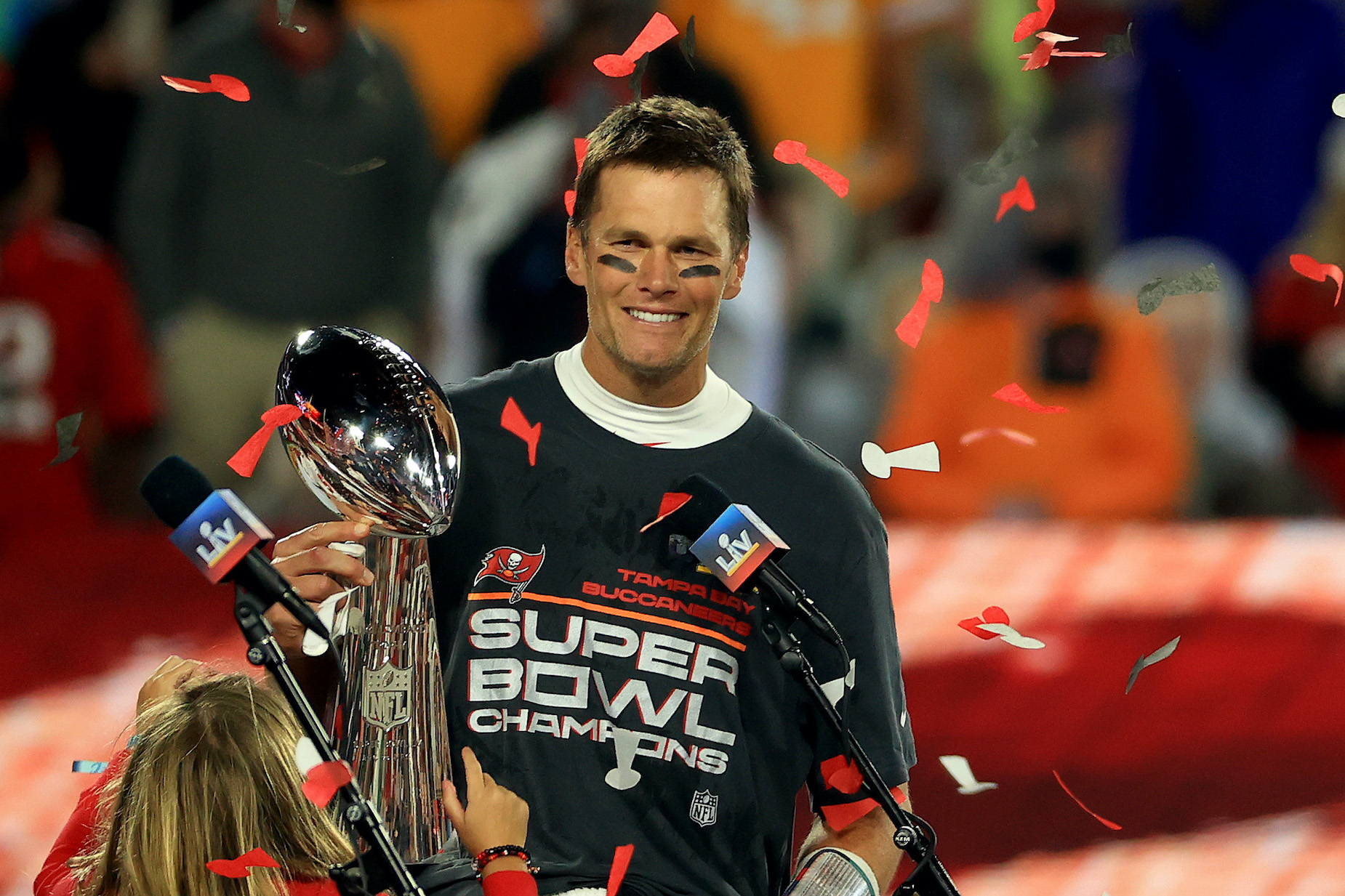 Tom Brady receives the Lombardi Trophy after the Tampa Bay Buccaneers claimed victory in Super Bowl 55.