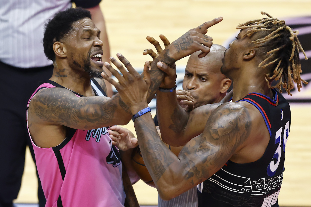 Udonis Haslem of the Miami Heat and Dwight Howard of the Philadelphia 76ers are broken up by referee Sean Corbin while being involved in a scuffle during the second quarter at American Airlines Arena on May 13, 2021 in Miami, Florida.