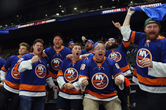 Members of the New York Jets football team including Zach Wilson (L) attend the New York Islanders game against the Pittsburgh Penguins in Game Four of the First Round of the 2021 Stanley Cup Playoffs at the Nassau Coliseum on May 22, 2021 in Uniondale, New York.
