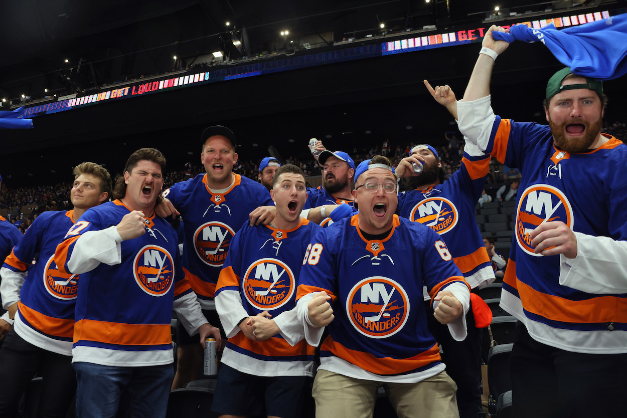 Members of the New York Jets football team including Zach Wilson (L) attend the New York Islanders game against the Pittsburgh Penguins in Game Four of the First Round of the 2021 Stanley Cup Playoffs at the Nassau Coliseum on May 22, 2021 in Uniondale, New York.