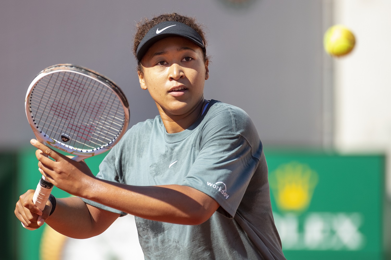 Naomi Osaka practices in preparation for the 2021 French Open at Roland Garros. | Tim Clayton/Corbis via Getty Images