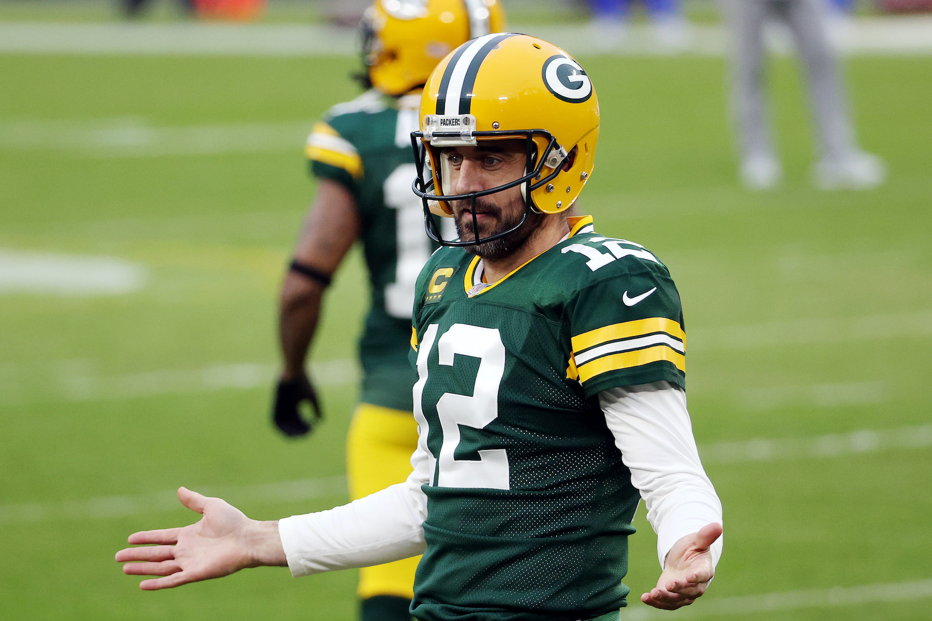 Green Bay Packers quarterback Aaron Rodgers gestures on the field