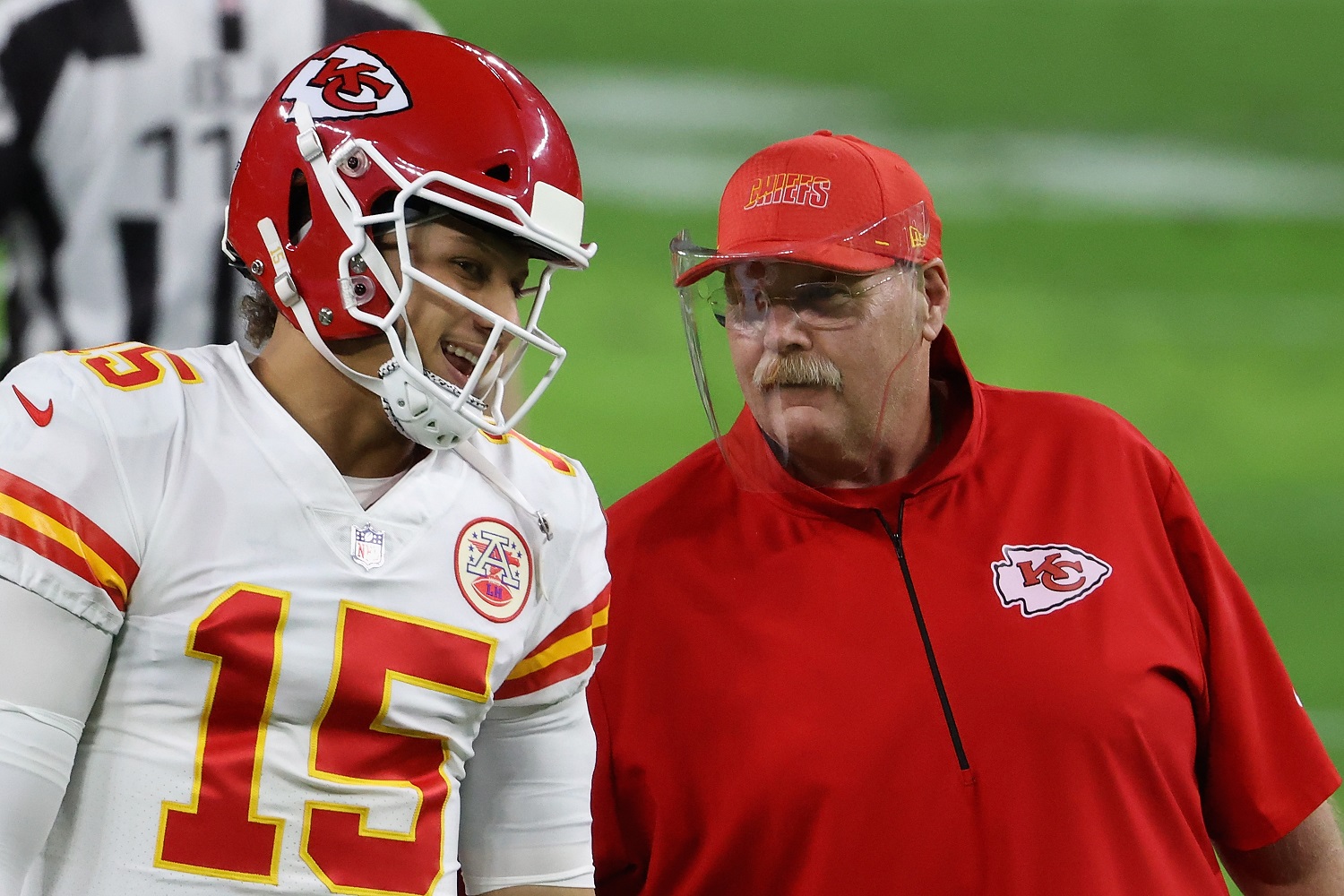 Quarterback Patrick Mahomes of the Kansas City Chiefs talks with head coach Andy Reid before the NFL game against the Las Vegas Raiders on Nov. 22, 2020.