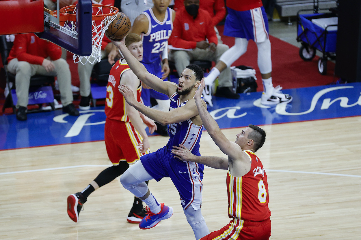 Sixers point guard Ben Simmons attempts a layup