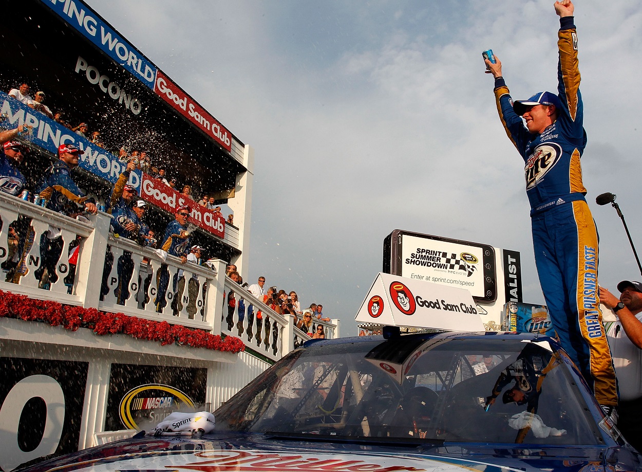 Brad Keselowski celebrates after winning the 2011 NASCAR Cup Series Good Sam RV Insurance 500 at Pocono Raceway