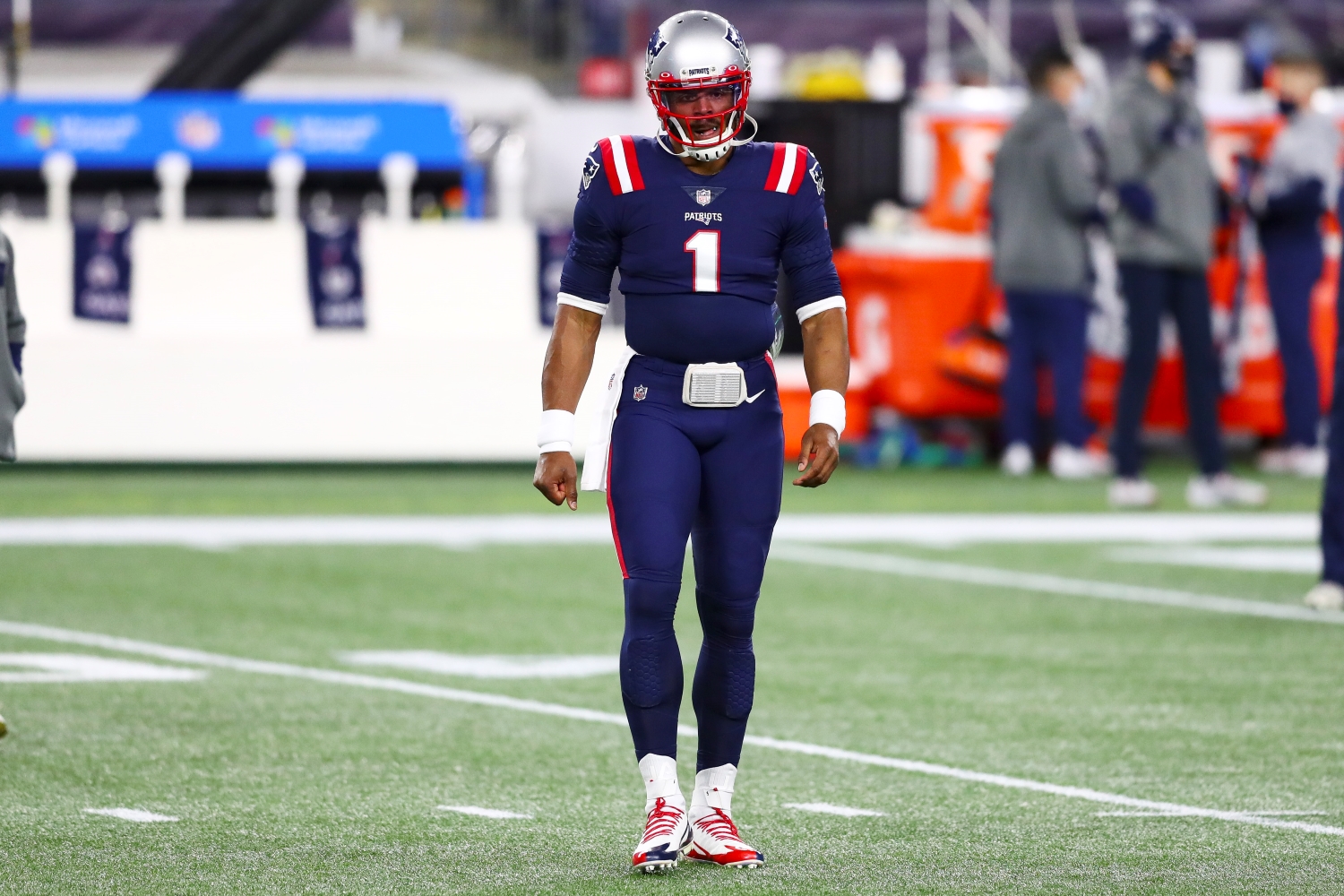 Patriots QB Cam Newton walks off the field.