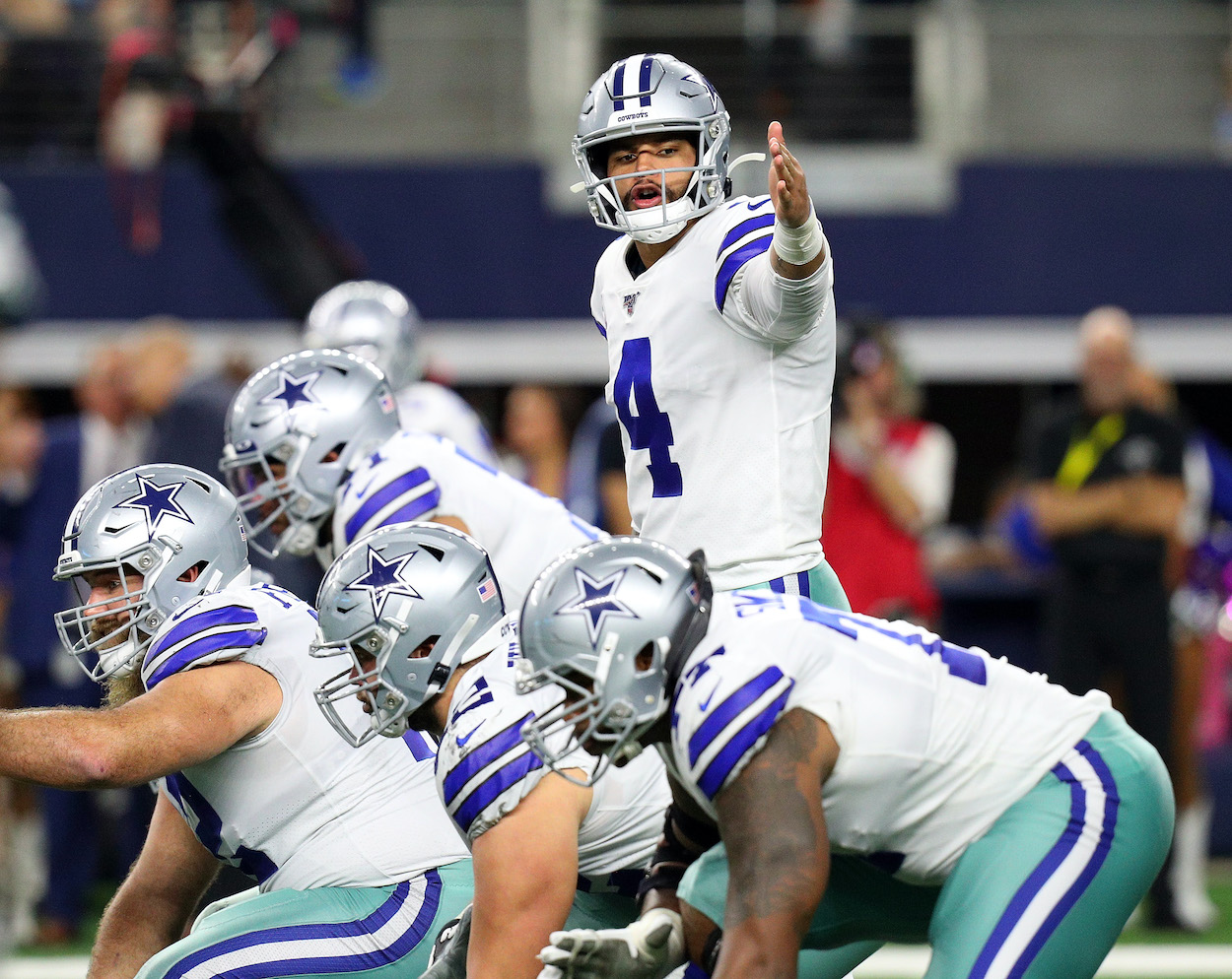 Dak Prescott of the Dallas Cowboys with the offensive line against the Philadelphia Eagles at AT&T Stadium on October 20, 2019 in Arlington, Texas.
