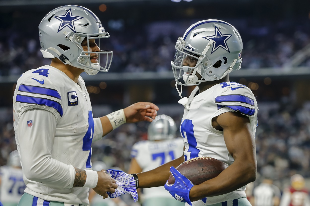 Dallas Cowboys teammates Dak Prescott and Michael Gallup celebrate a touchdown against Washington in December 2019