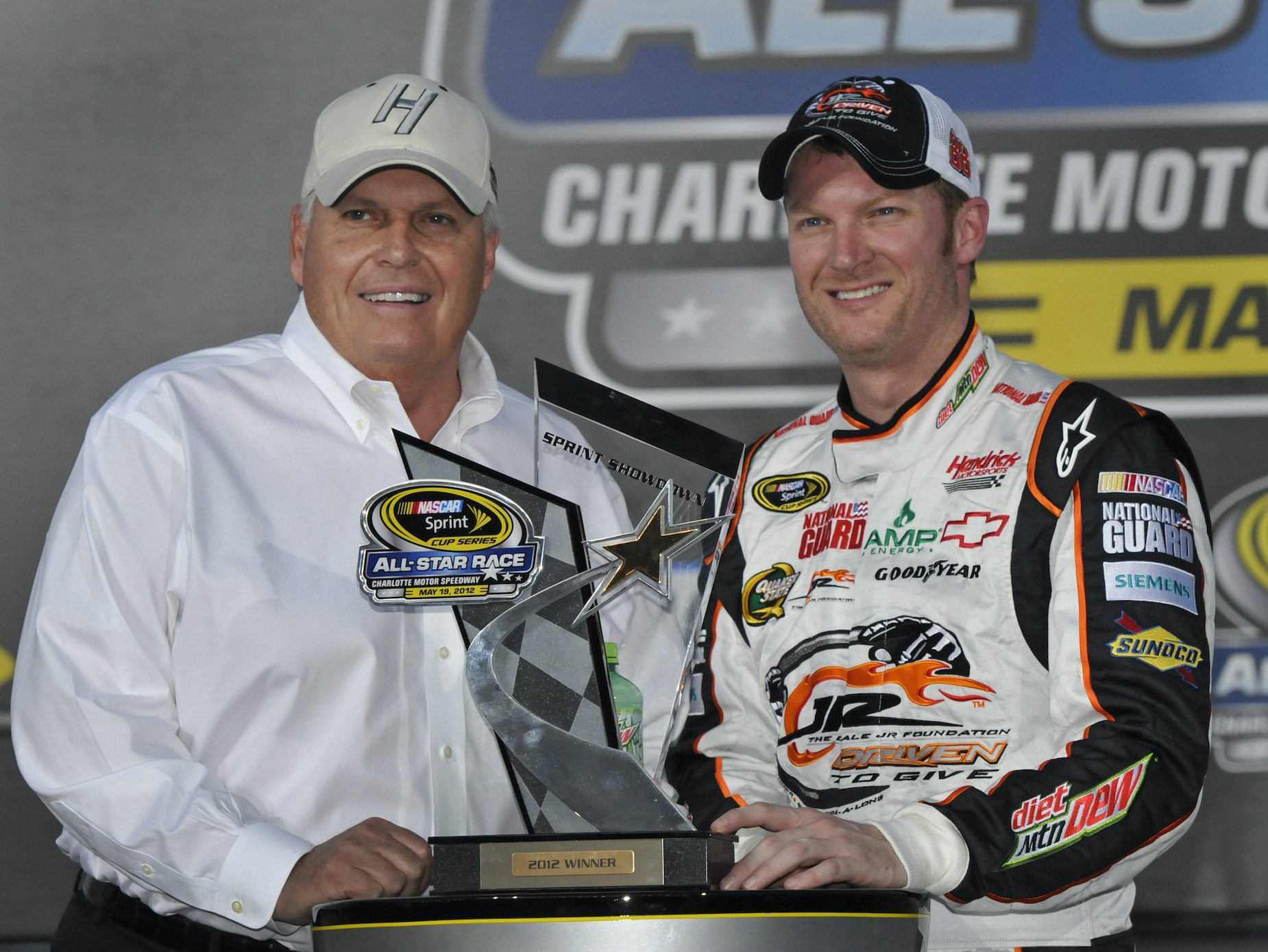 Dale Earnhardt Jr. claims the Sprint Showdown trophy at the 2021 NASCAR All-Star Race.