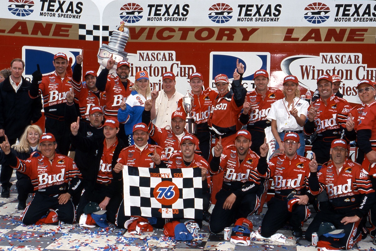 Dale Earnhardt Jr. and his crew celebrate after winning the 2000 NASCAR Cup Series DirecTV 500 at Texas Motor Speedway