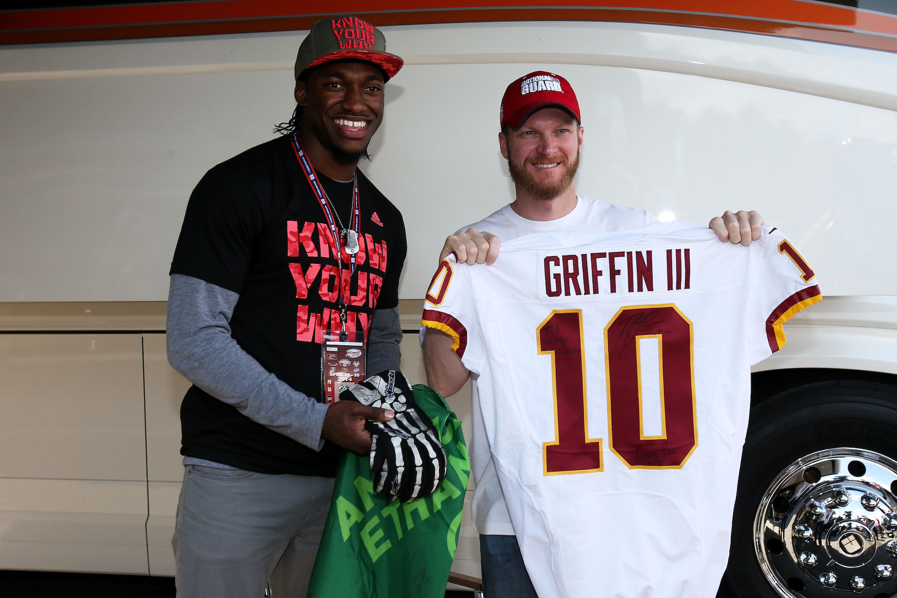 Dale Earnhardt Jr. and Robert Griffin III exchange some gear in 2014.