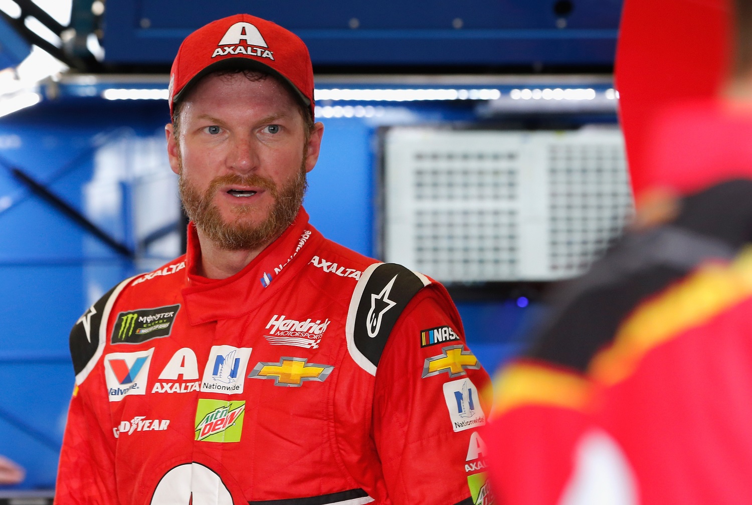 Dale Earnhardt Jr. stands in the garage area during practice for the Monster Energy NASCAR Cup Series Championship Ford EcoBoost 400 at Homestead-Miami Speedway on Nov. 18, 2017.