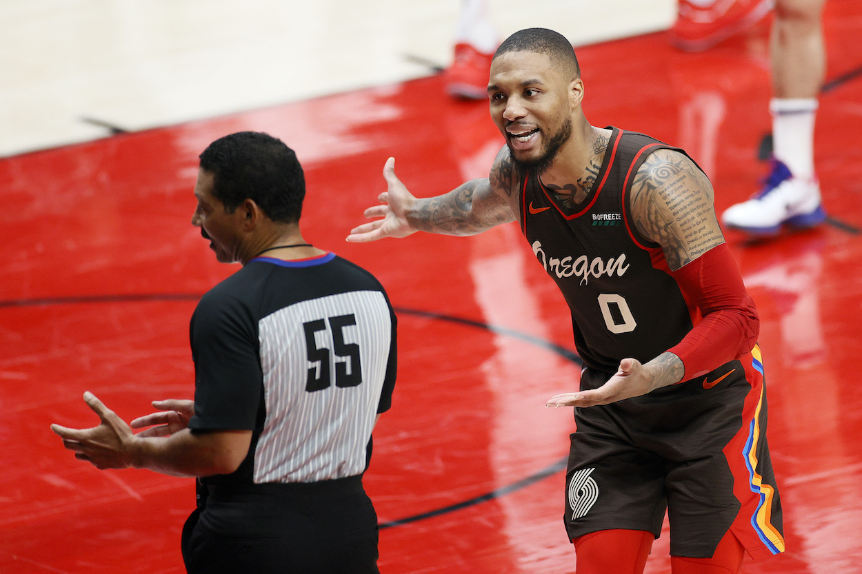 Damian Lillard of the Portland Trail Blazers reacts toward the official in the second quarter against the Denver Nuggets during Round 1, Game 6 of the 2021 NBA Playoffs at Moda Center on June 03, 2021 in Portland, Oregon.