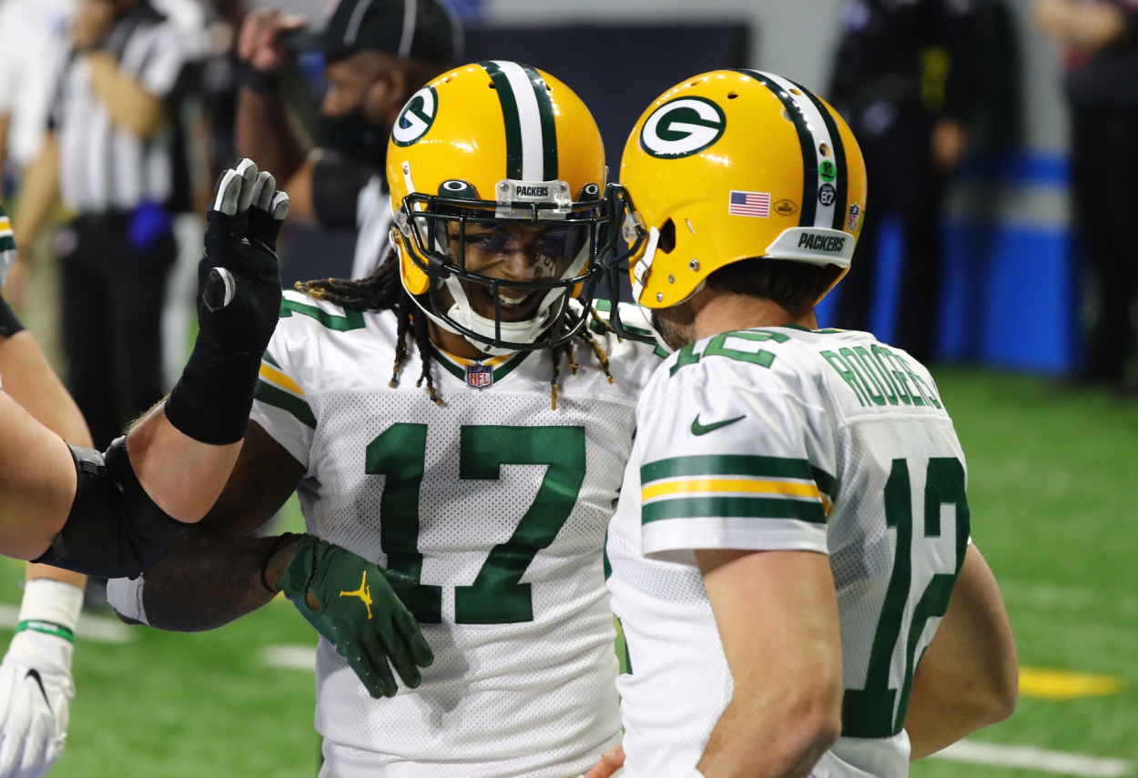 Davante Adams and Aaron Rodgers celebrated during a Green Bay Packers game.
