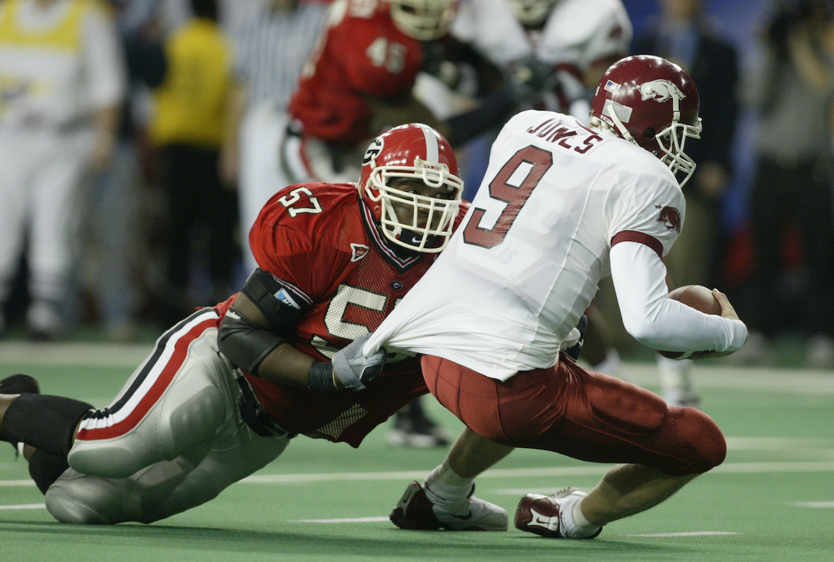 Defensive tackle Johnathan Sullivan of the University of Georgia Bulldogs sacks quarterback Matt Jones of the University of Arkansas Razorbacks during the SEC Championship game in 2002