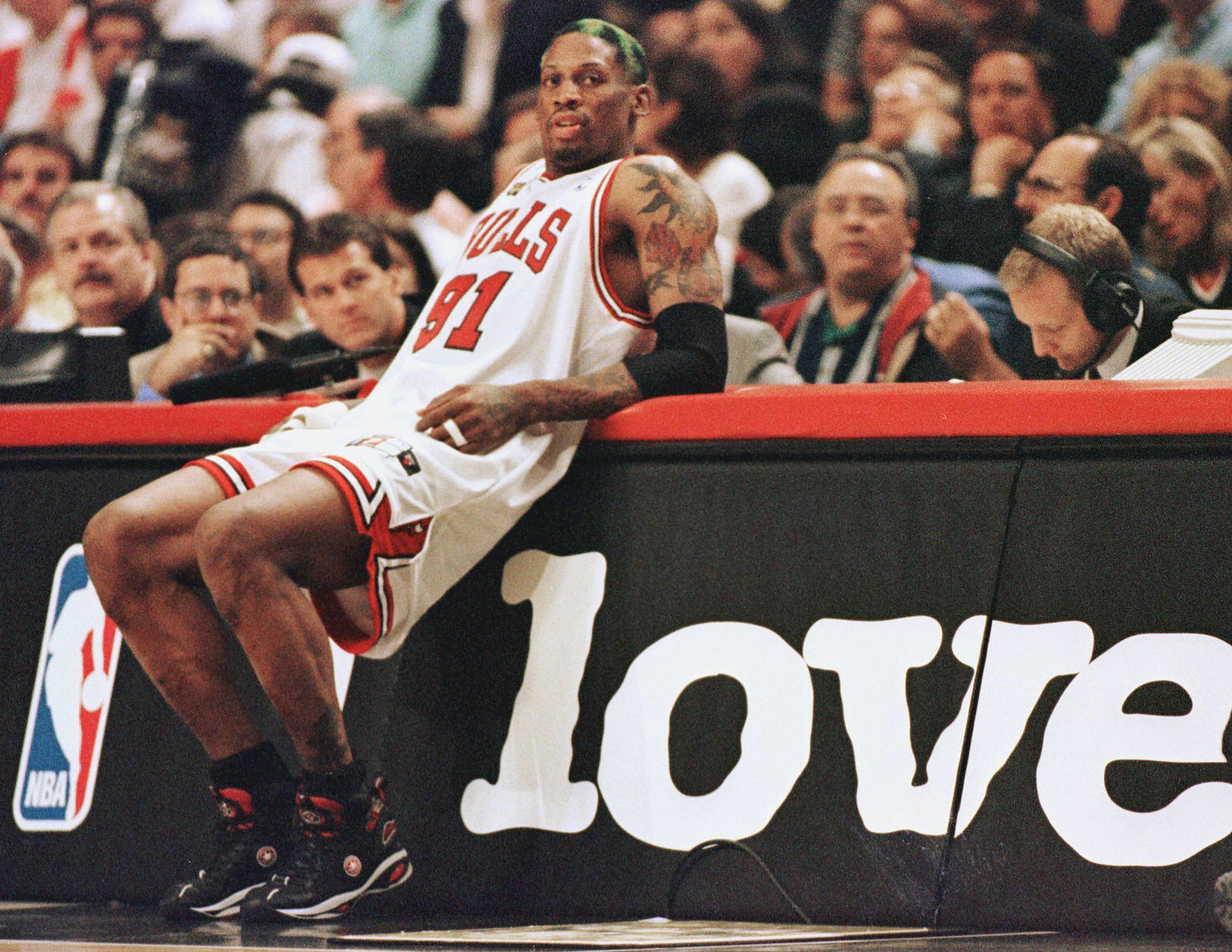 Dennis Rodman stands on the sidelines as a member of the Chicago Bulls.