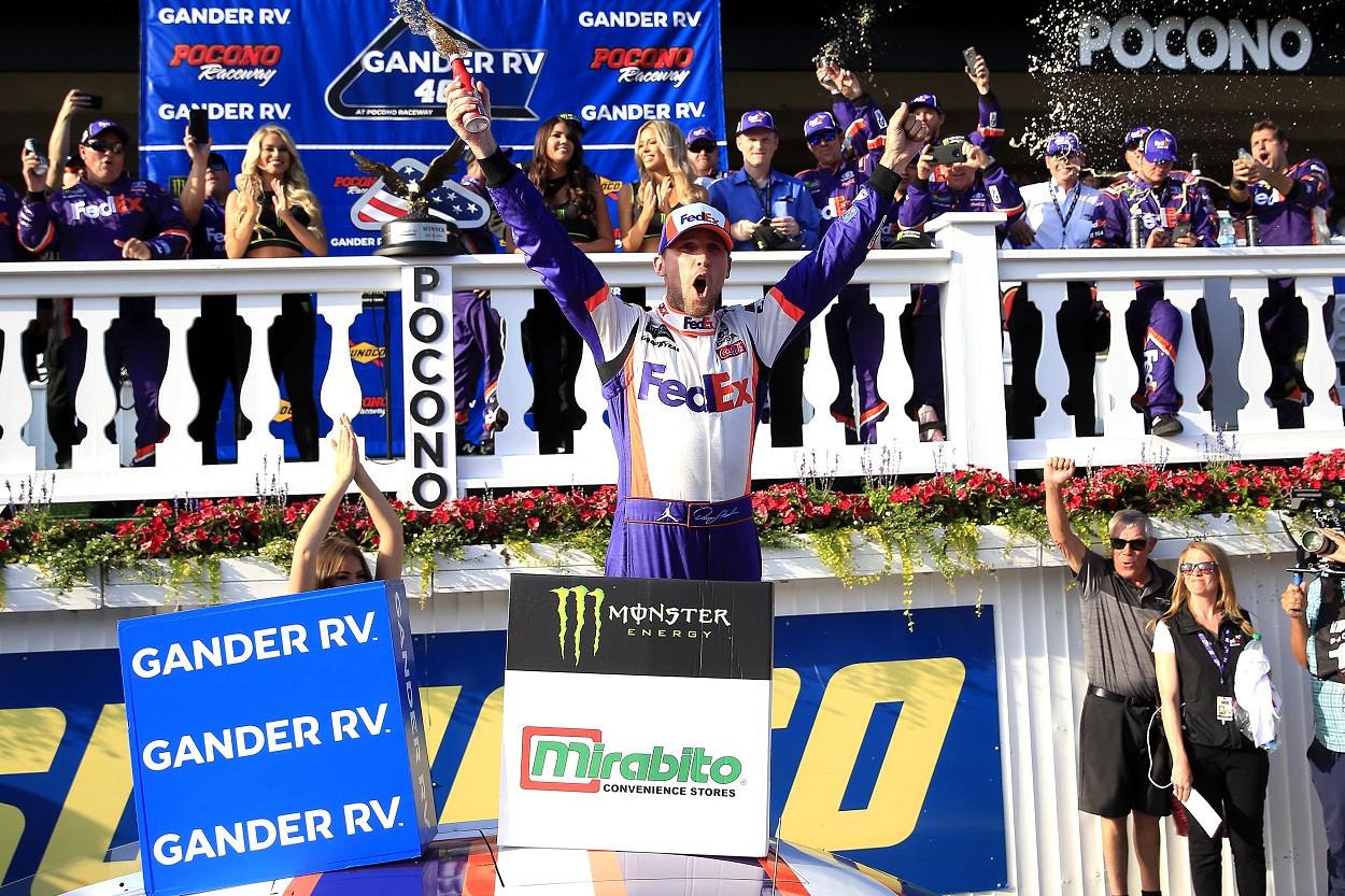 Denny Hamlin celebrates his win at the 2019 NASCAR Cup Series Gander RV 400 at Pocono Raceway