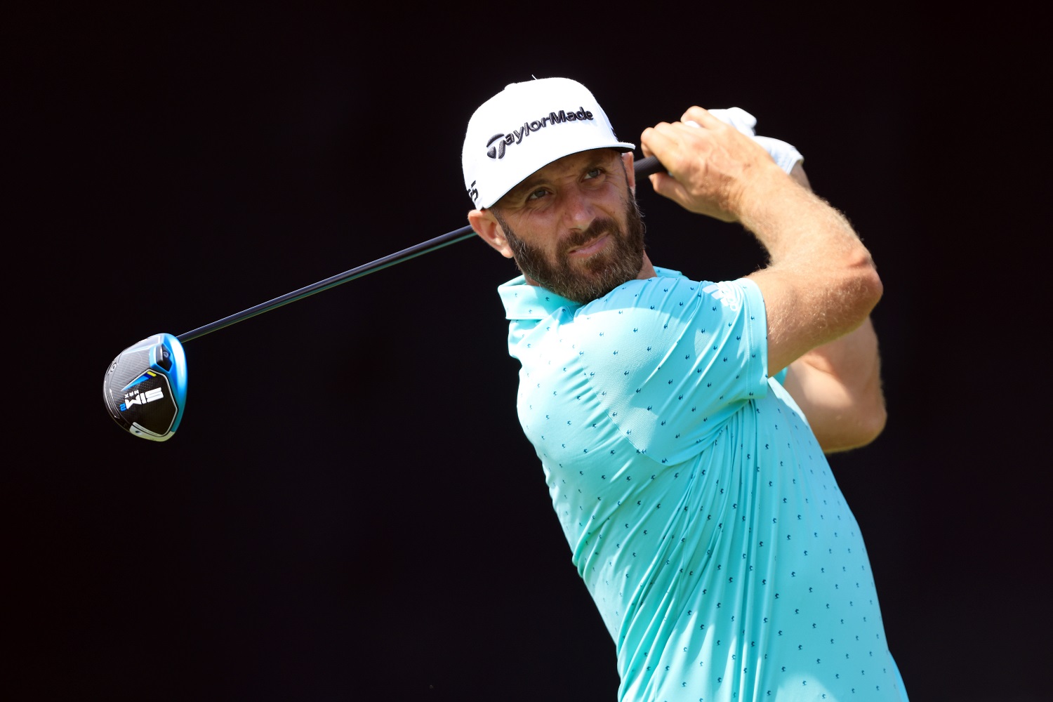 Dustin Johnson plays his shot from the seventh tee during a practice round prior to the start of the 2021 U.S. Open at Torrey Pines Golf Course on June 16, 2021, in San Diego.