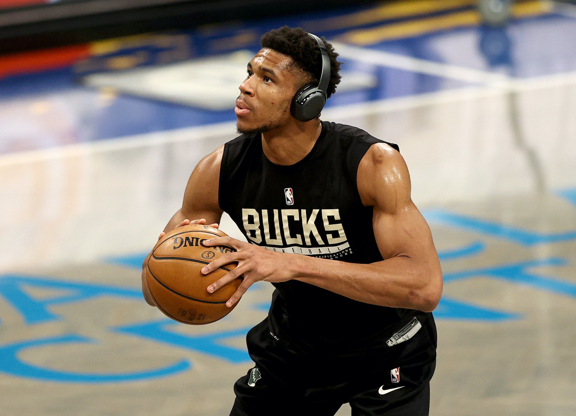 Milwaukee Bucks forward Giannis Antetokounmpo takes a free throw ahead of a 2021 NBA playoff game.