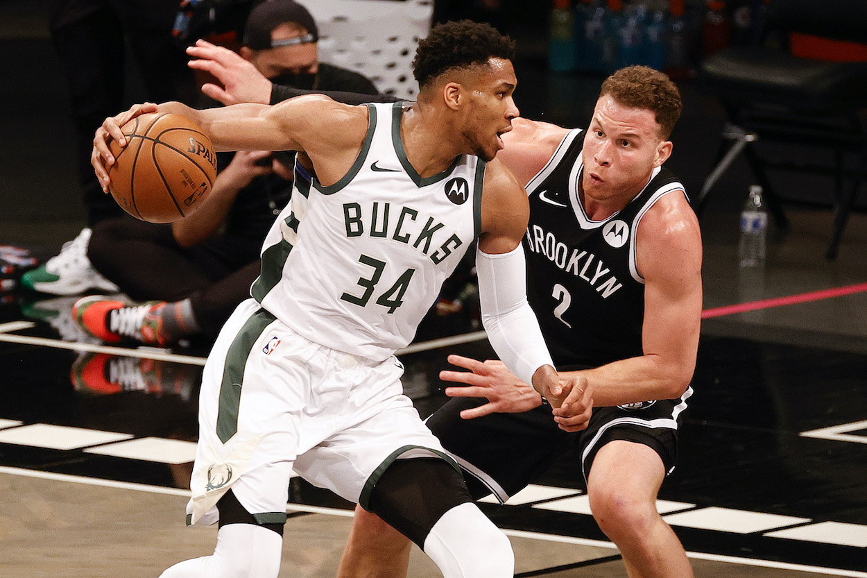 Blake Griffin of the Brooklyn Nets guards Giannis Antetokounmpo of the Milwaukee Bucks during the third quarter during Game One of the Eastern Conference second round series at Barclays Center on June 05, 2021 in New York City.