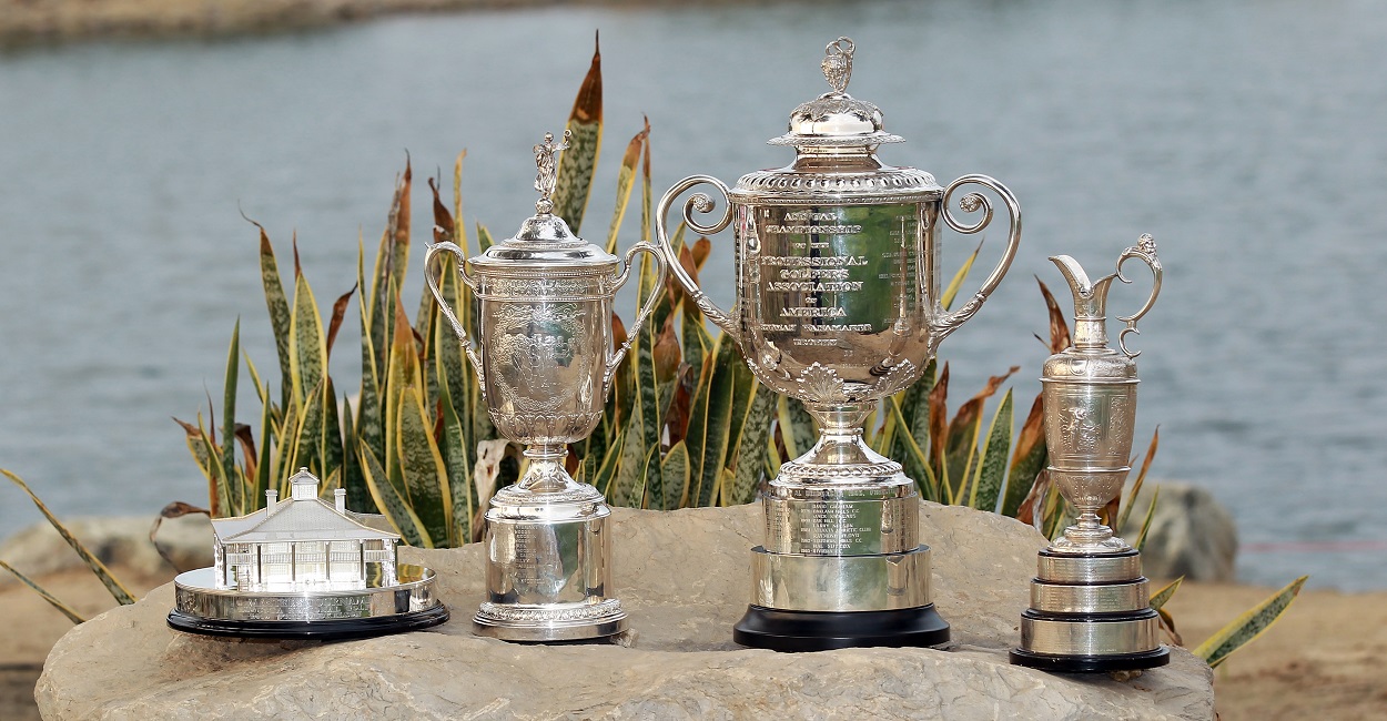 The golf major championship trophies of The Masters, U.S. Open, The Open Championship, and PGA Championship