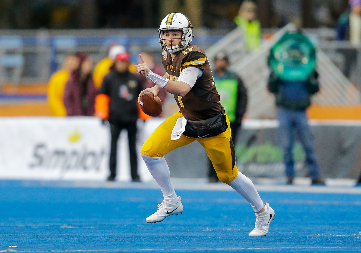 Former Wyoming Cowboys quarterback Josh Allen scrambles during the Famous Idaho Potato Bowl in 2017.