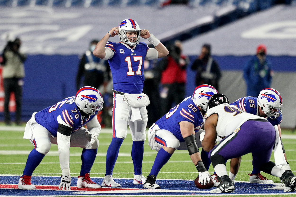 Josh Allen of the Buffalo Bills signals during the third quarter of an AFC Divisional Playoff game against the Baltimore Ravens at Bills Stadium on January 16, 2021 in Orchard Park, New York.