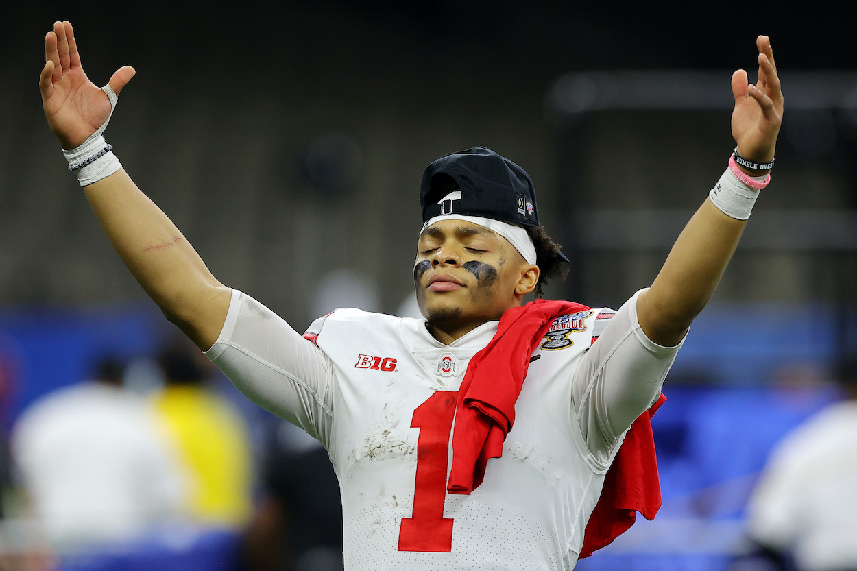 Justin Fields' contract makes him the first 2021 first-round quarterback to sign. The QB is seen here celebrating at Ohio State.