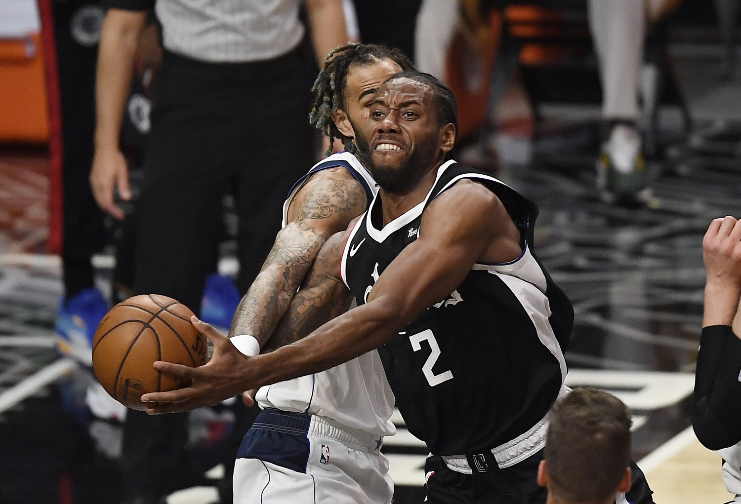 Kawhi Leonard of the Los Angeles Clippers is fouled by Willie Cauley-Stein of the Dallas Mavericks during the first half of Game 5 of the Western Conference first round series.