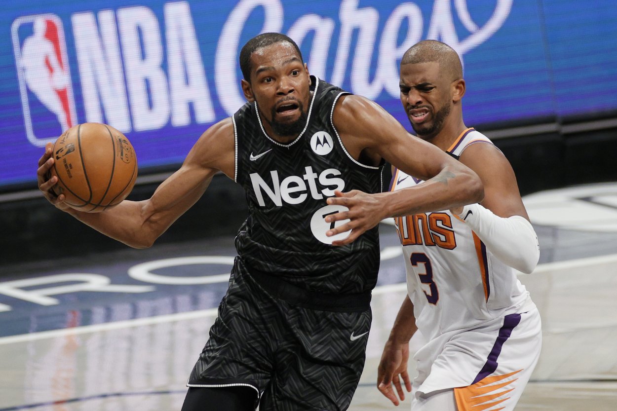 NBA stars Kevin Durant (L) and Chris Paul in 2021. Both should hope the 2021-22 does not start in October as the league hoped.