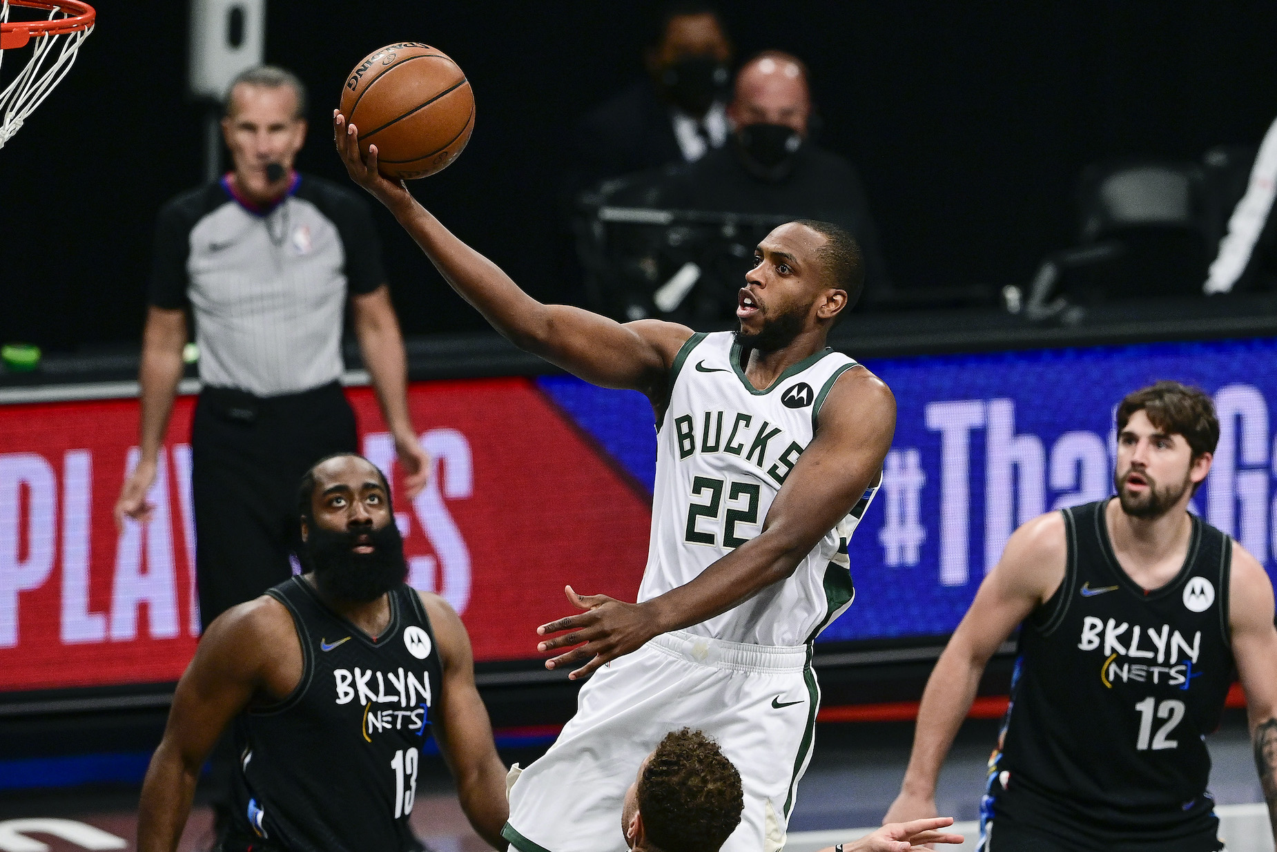 Khris Middleton drives to the basket during a Milwaukee Bucks playoff game.