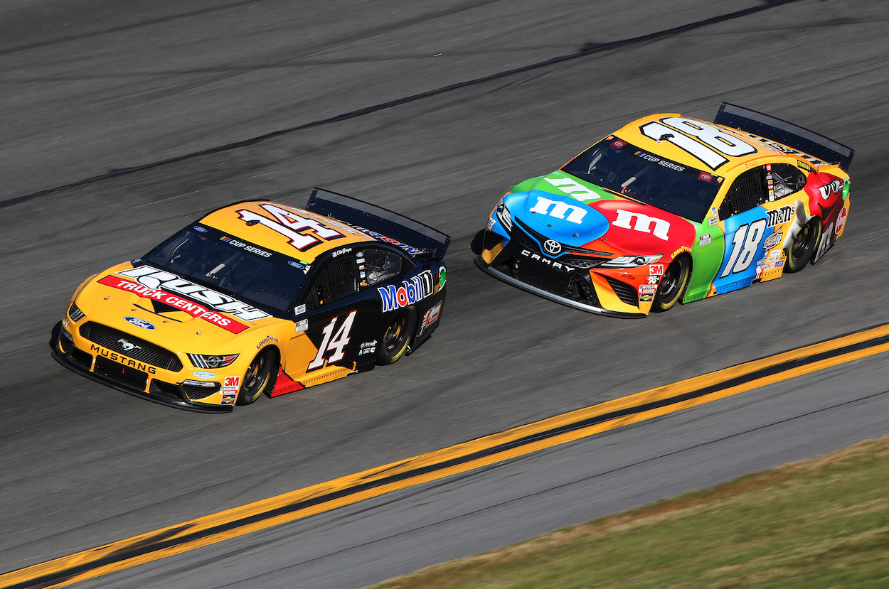 Clint Bowyer and Kyle Busch race against each other