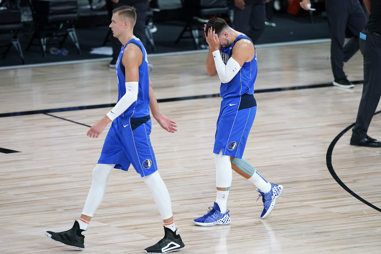 Luka Doncic and Kristaps Porzingis of the Dallas Mavericks leave the court after the first half of Game Three of the first round of the playoffs at the AdventHealth Arena at the ESPN Wide World Of Sports Complex on August 21, 2020.