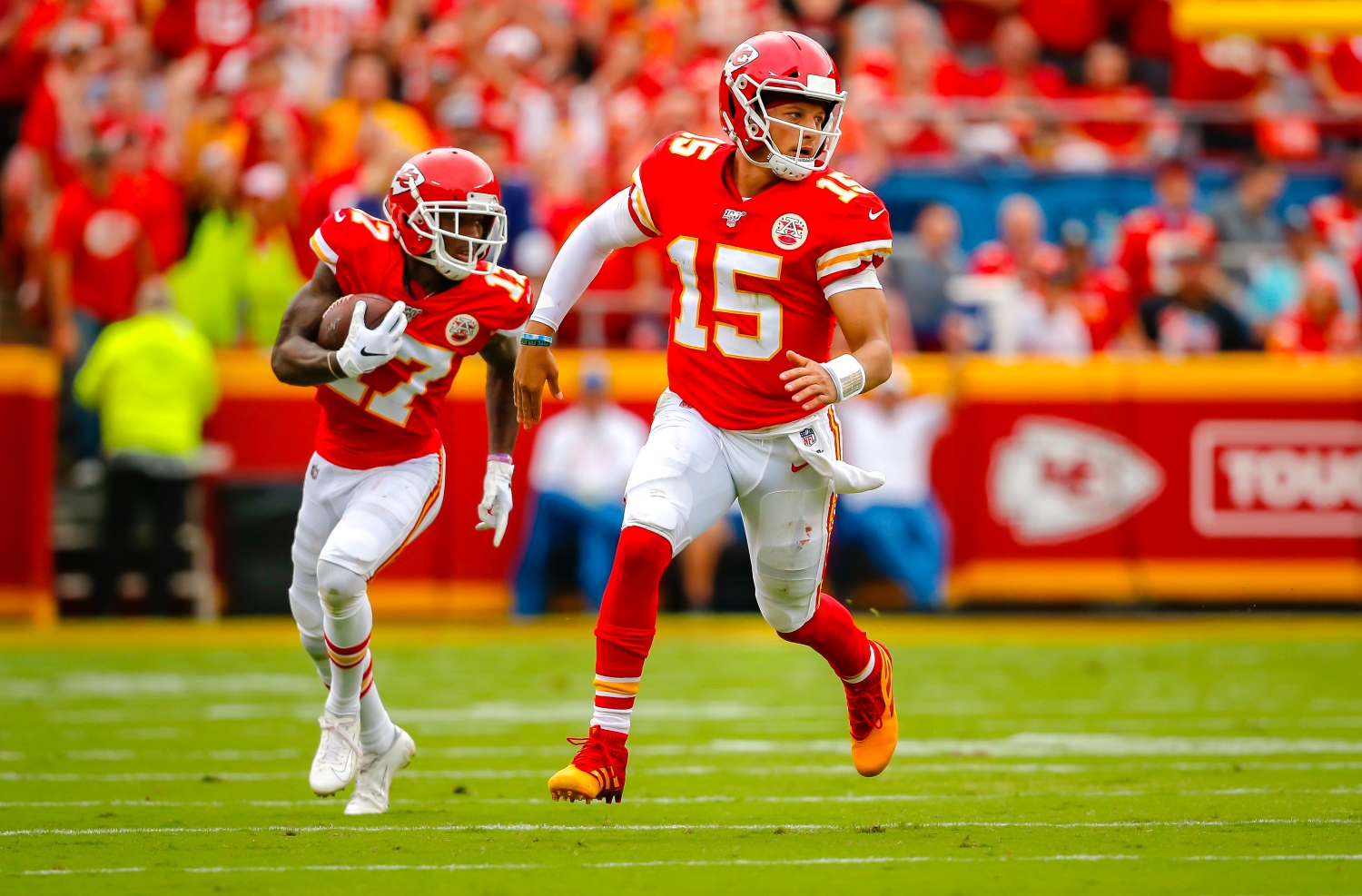 Kansas City Chiefs receiver Mecole Hardman runs behind Patrick Mahomes.