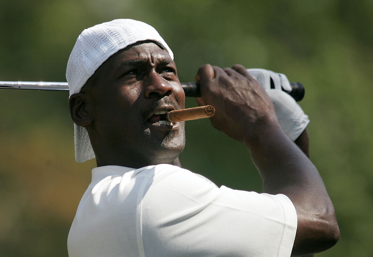 Michael Jordan hits a shot on the golf course