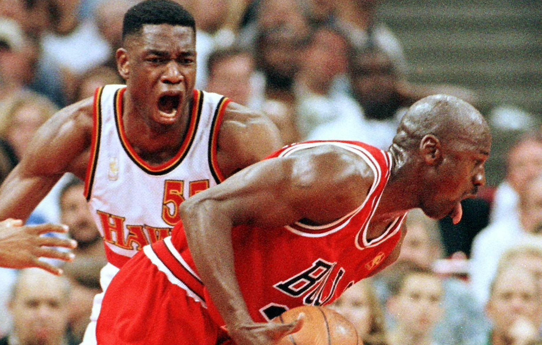 Michael Jordan and Dikembe Mutombo square off during the 1997 NBA playoffs.