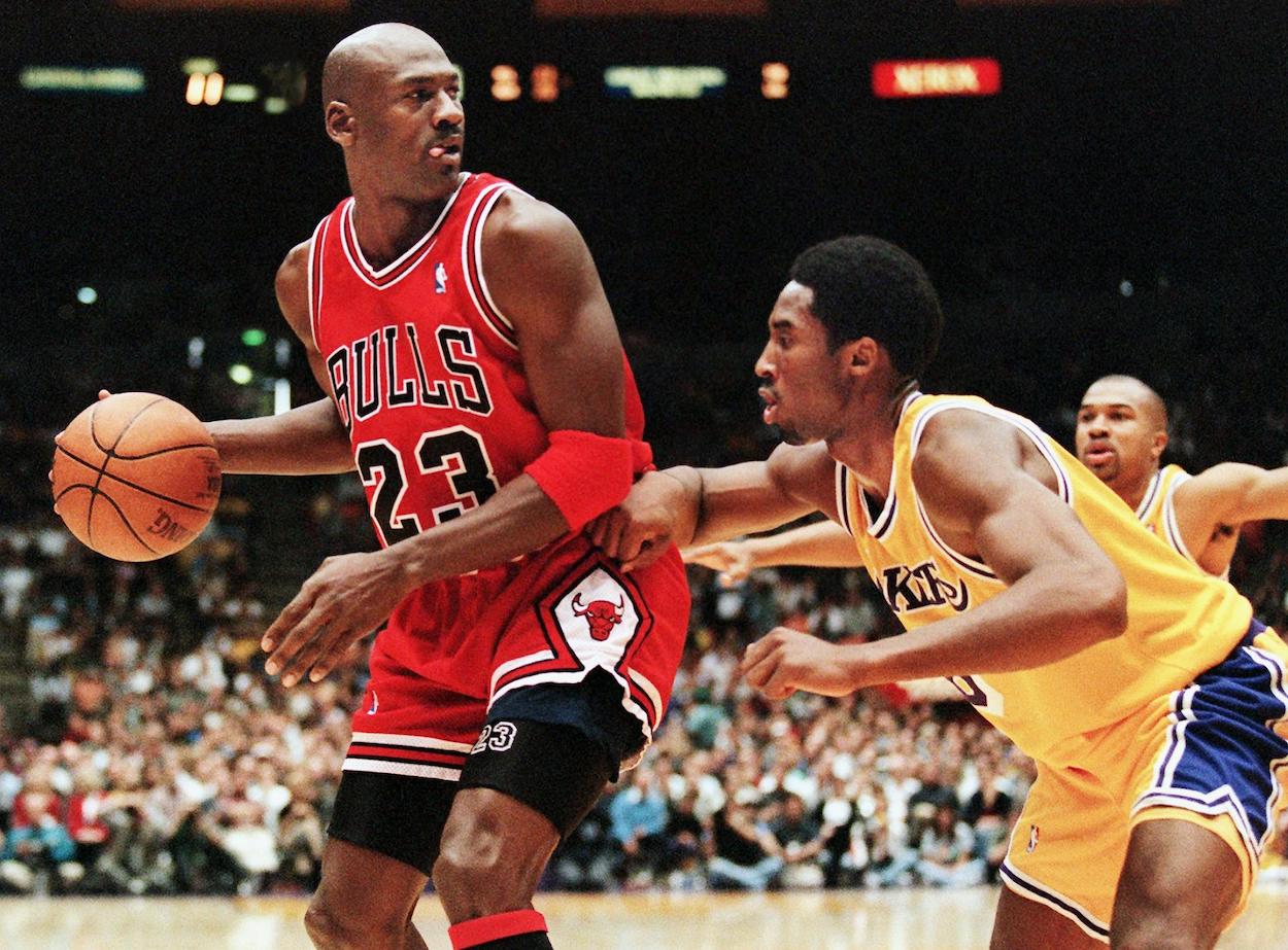 Michael Jordan of the Chicago Bulls is guarded by Kobe Bryant of the Los Angeles Lakers in 1998