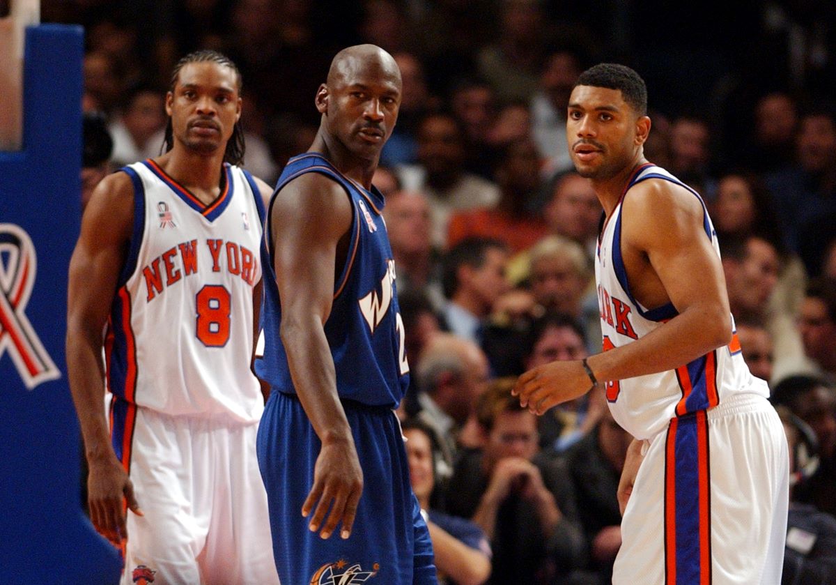 Michael Jordan is guarded by the Knicks.