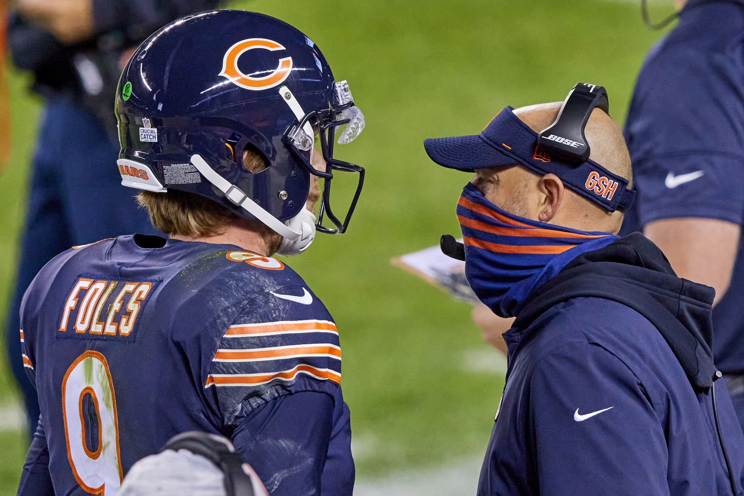 Nick Foles talks to Bears head coach Matt Nagy during a game.